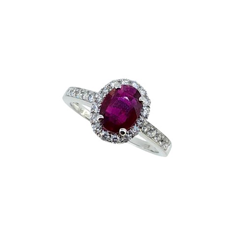 Lot 241 - An 18ct gold Burmese ruby and diamond halo style cluster ring