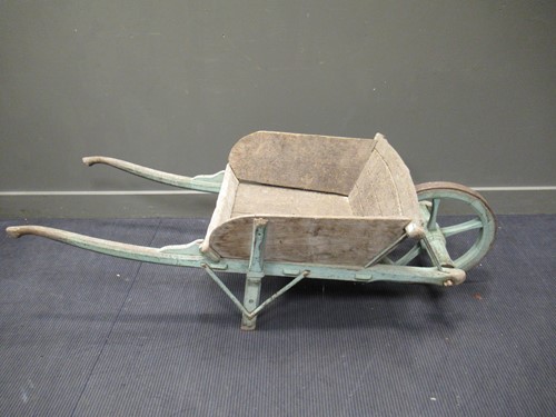 Lot 408 - A painted pine wheelbarrow, 52 x 70 x 160