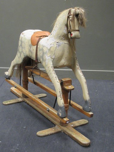 Lot 451 - A large painted rocking horse, 119 x 175 x 62cm
