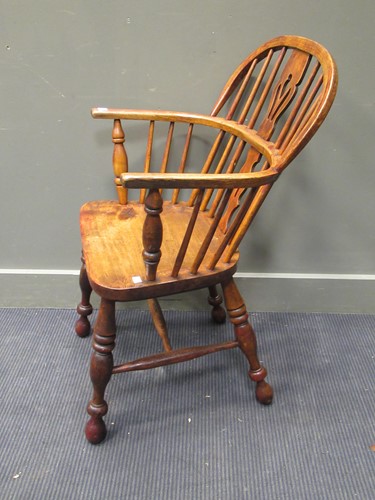 Lot 335 - A Windsor armchair on turned legs united by a...