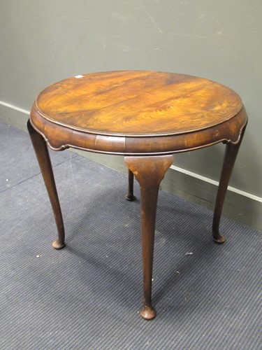 Lot 459 - A walnut circular occasional table, with...