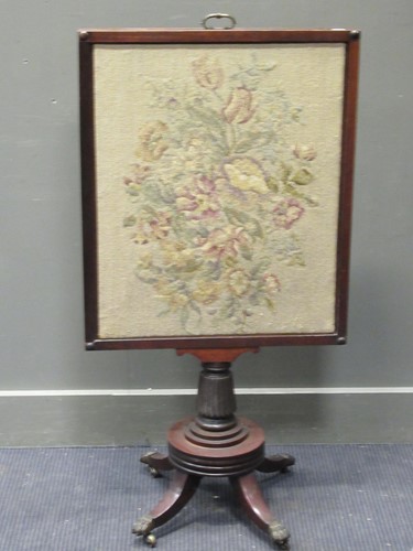 Lot 311 - A Regency mahogany fire screen with lift up...
