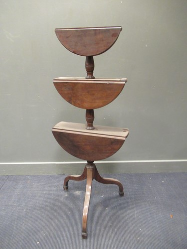 Lot 308 - A 19th century mahogany three tier drop flap...