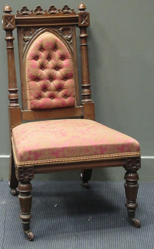 Lot 385 - A Gothic style carved oak chair, on carved and...