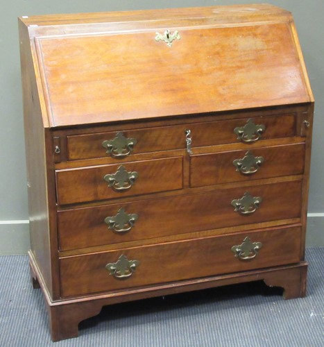 Lot 276 - A George III mahogany bureau with brass...