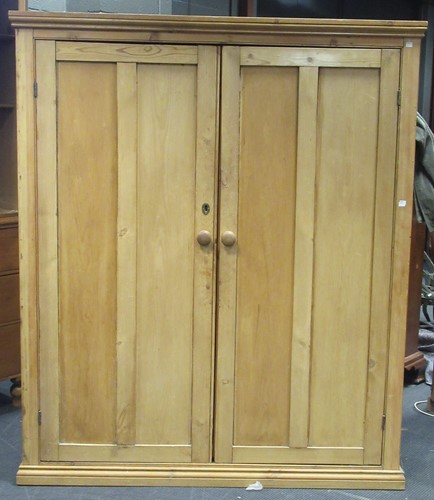 Lot 282 - A pine wardrobe, the interior fitted with 5...