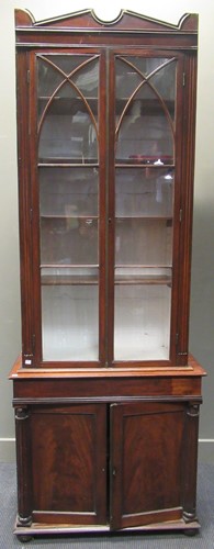 Lot 330 - A mahogany bookcase with glazed top and...