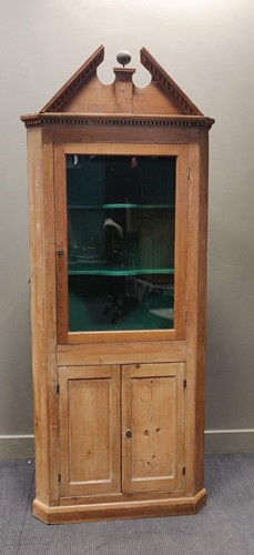 Lot 340 - A George III stripped pine glazed corner...