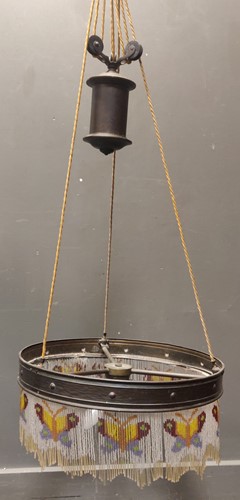 Lot 84 - A brass counterweight lamp shade with beaded...