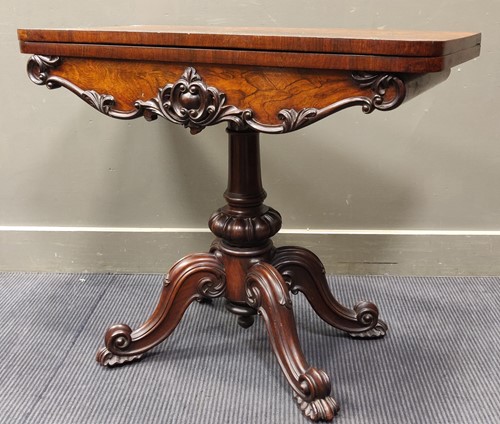 Lot 349 - A Victorian rosewood card table, with red felt...