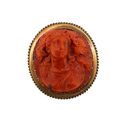 Lot 27 - A 19th century carved coral memorial brooch