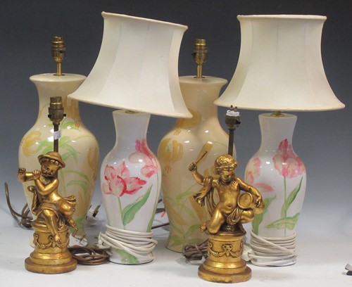 Lot 29 - A pair of cream lamps decorated with lilies;...