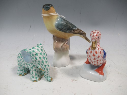 Lot 52 - Herend green fishnet elephant, a red fishnet...