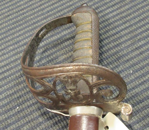 Lot 117 - A British Rifles sword in a brown leather...