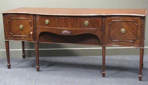 Lot 384 - A 19th century mahogany serpentine sideboard,...