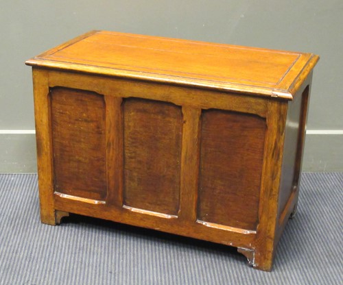 Lot 397 - A 20th century oak panelled coffer on bracket...