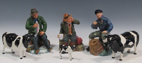 Lot 21 - A set of three Beswick models of Friesian cows;...
