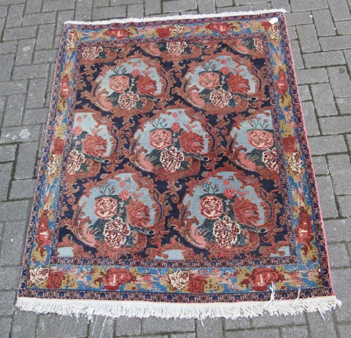 Lot 411 - A Senneh floral decorated hand knotted wool...
