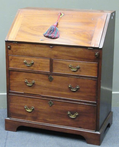 Lot 343 - A George III flame mahogany bureau, the fitted...