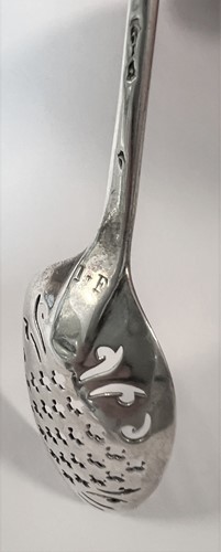Lot 411 - An 18th century silver mote spoon