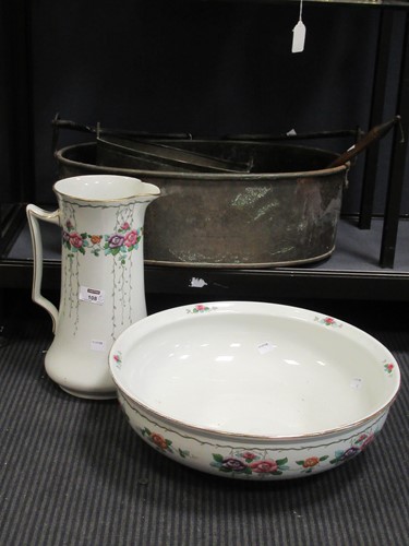 Lot 108 - A floral decorated wash bowl and jug, by Aden...