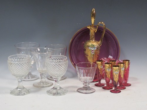 Lot 103 - A Bohemian gilt overlaid cranberry glass...