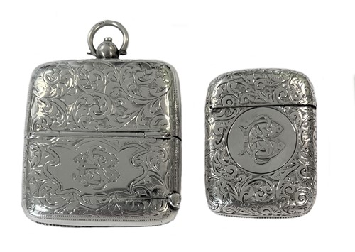 Lot 383 - A silver combination sovereign holder and vesta case, together with a silver vesta case