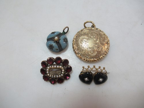 Lot 211 - A quartet of memorial jewels, with the pendant...