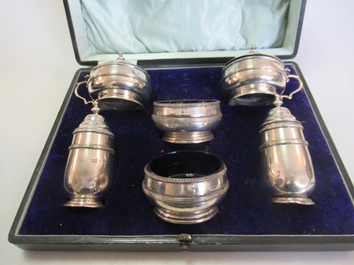 Lot 234 - A cased silver 6 piece cruet set along with a...