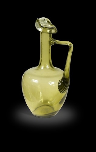 Lot 1 - Attributed to Dr Christopher Dresser for Thomas Webb & Sons, an olive green glass ewer, circa 1880