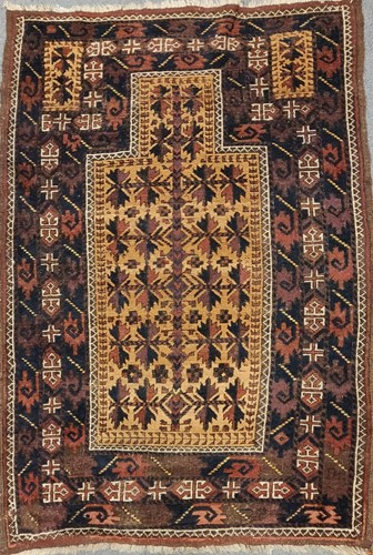 Lot 24 - A late 19th century Belouchi prayer rug, with...