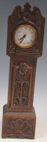 Lot 70 - A miniature longcase clock with Arabic chapter...