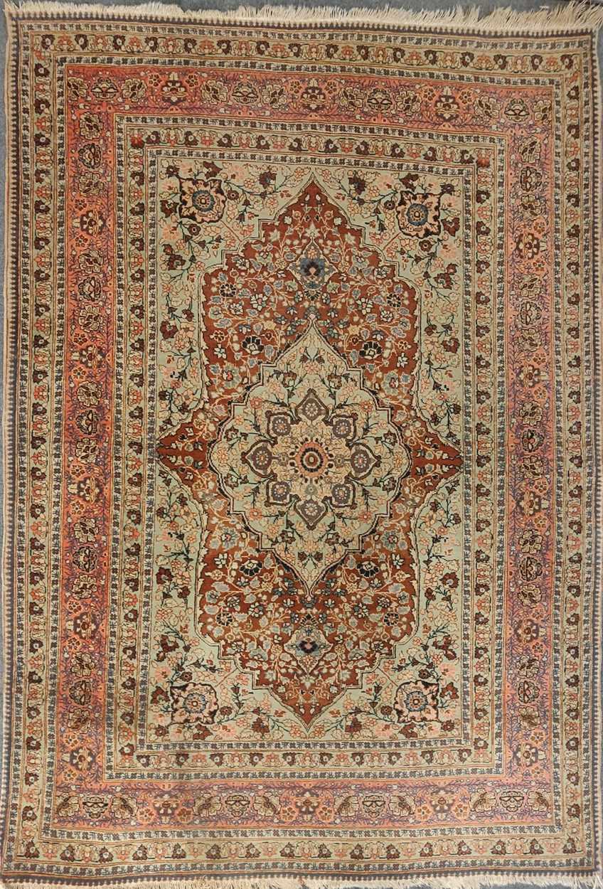Lot 27 - An early 20th century Kashan rug with rust...