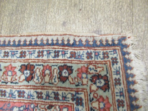 Lot 27 - An early 20th century Kashan rug with rust...