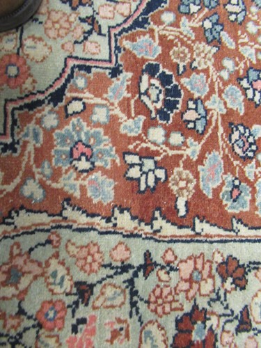 Lot 27 - An early 20th century Kashan rug with rust...