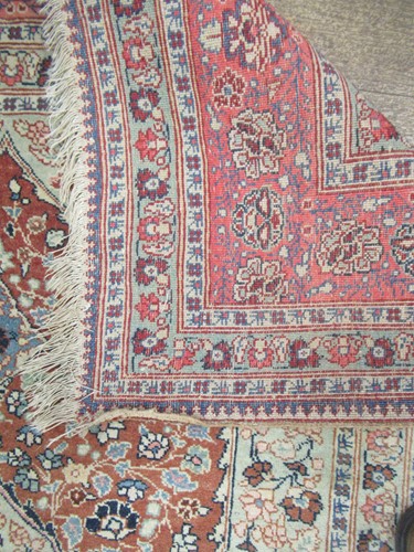 Lot 27 - An early 20th century Kashan rug with rust...