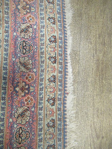 Lot 27 - An early 20th century Kashan rug with rust...