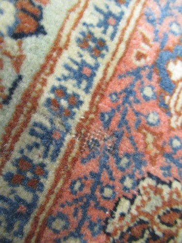 Lot 27 - An early 20th century Kashan rug with rust...