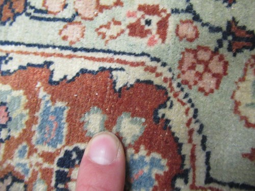 Lot 27 - An early 20th century Kashan rug with rust...