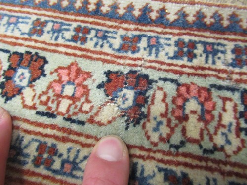 Lot 27 - An early 20th century Kashan rug with rust...