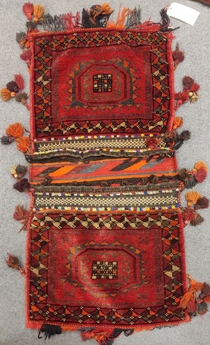 Lot 45 - An Afghan saddle bag, a hanging, and saddle...