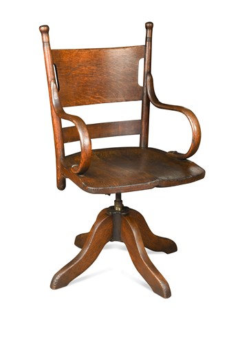 Lot 202 - An early 20th century stained oak and elm swivel desk chair