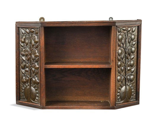 Lot 213 - An Arts & Crafts oak hanging shelf