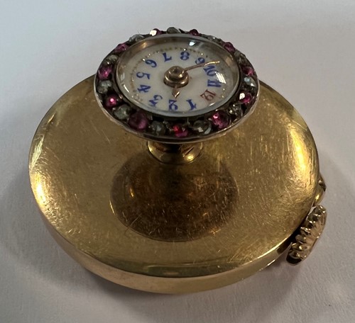 Lot 316 - J. Pourrat et Fils, Genève - A rare Swiss 18ct gold gem set lapel watch