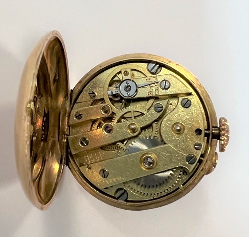 Lot 316 - J. Pourrat et Fils, Genève - A rare Swiss 18ct gold gem set lapel watch