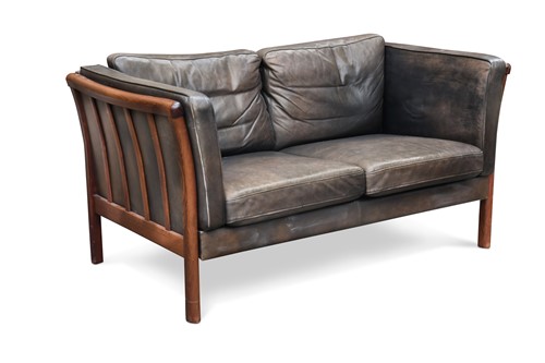 Lot 294 - A Stouby style black leather two-seater sofa