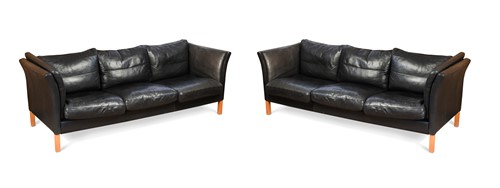 Lot 291 - A pair of Danish Skalma black leather three-seat sofas