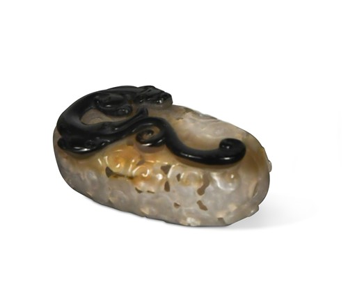 Lot 75 - A Chinese carved agate small chilong large  bead, late Qing Dynasty