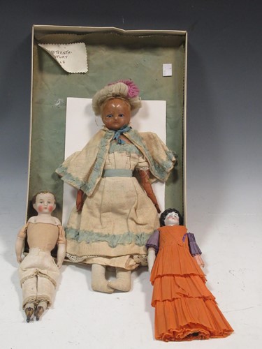 Lot 137 - A bisque head doll; together with two others...