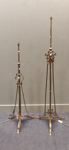Lot 364 - A matched pair of two brass standard lamps...